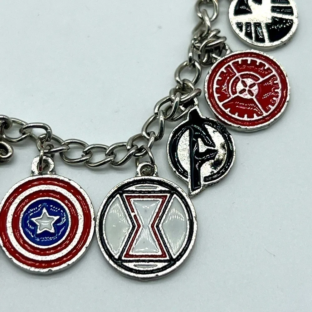 AVENGERS character charm bracelet featuring Thor’s hammer and other symbols